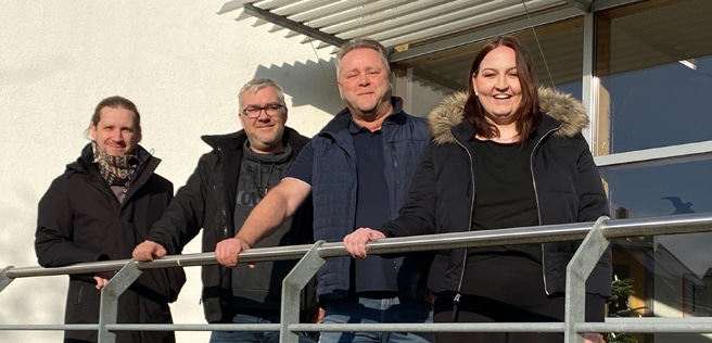 Das Foto zeigt vier anona Mitarbeitende.